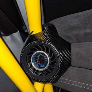 Black turbine-style 52mm gauge mount fitted in a MINI dashboard with a water temperature gauge.